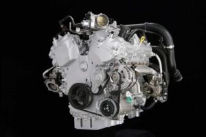 Ford's Ecoboost V-6 relies on a pair of small turbos -- which reduces turbo lag -- and a high-pressure fuel pump.  Fuel is injected directly into the cylinders, improving burn and reducing knock.  The automaker projects better performance as well as a 20% increase in fuel economy.