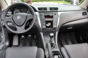 The interior of the 2010 Suzuki Kizashi is decidedly up-market from the automaker's earlier offerings, though Suzuki remains cautious about much of the latest tech features.