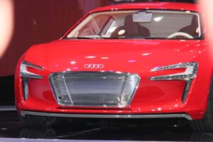The 2012 Audi e-tron appears to have a lot in common with the maker's R8 supercar, but it actually uses its own, super-light spaceframe, and is lower and smaller than the gasoline-powered supercar.
