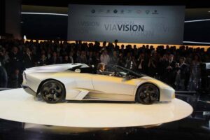 CEO Stephan Winklemann drives onto the stage in a 2010 Lamborghini Reventon Roadster, of which only 15 will be built.