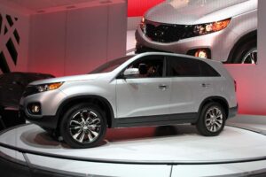 The first car to roll out of the Korean carmaker's new U.S. assembly plant, the 2011 Kia Sorento.