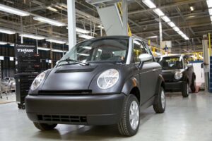 The First THINK City battery cars roll down the line at a new plant in Finland that also produces Porsche Boxsters.