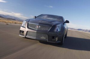 The mesh grille is the most immediate visual cue this is the 2011 Cadillac CTSv Coupe.