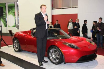 Tesla Motors founder Elon Musk, shown here .with the Tesla Roadster.