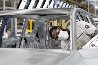An employee in the body shop at Stellantis’ Detroit Assembly Complex – Mack plant inspects the body of a Jeep® Grand Cherokee L to ensure it is within specification before it goes to the paint shop. The Company invested $1.6 billion to repurpose two existing facilities and build a paint shop to create the first new assembly plant in Detroit in 30 years and bring 3,850 new jobs to the city.