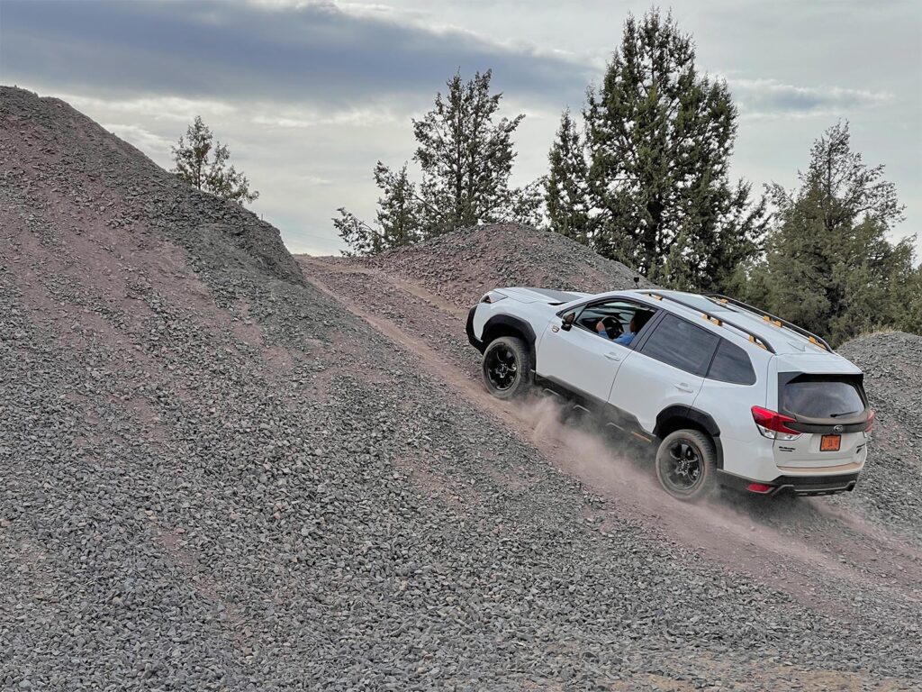 2022 Subaru Forester Wilderness - climbing gravel hill white