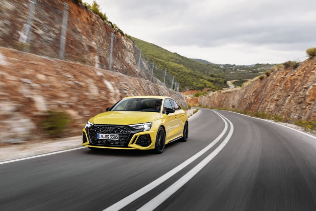 2022 Audi RS 3 driving yellow