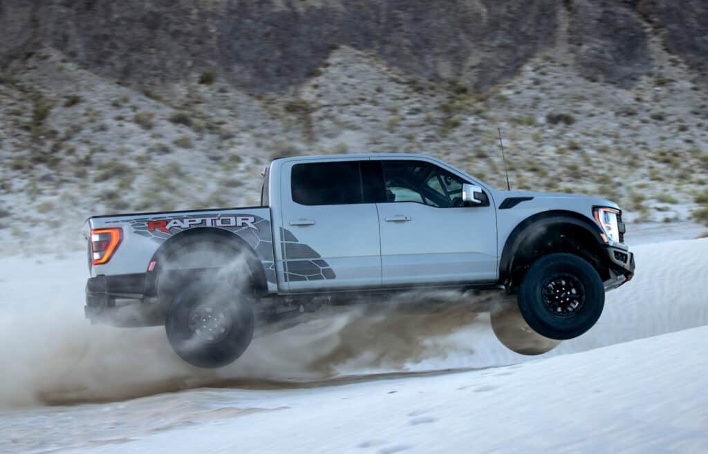 2023 F-150 Raptor R Avalanche Gray side jumping REL