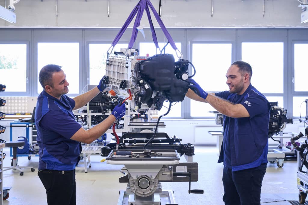 BMW techs work on fuel cell engine REL