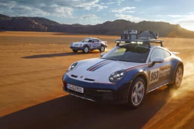 Porsche 911 Dakar pair racing in desert REL