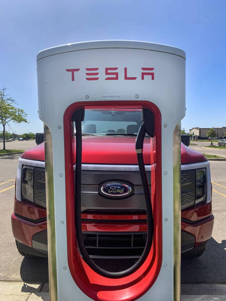 Ford F-150 Lightning charging at Tesla supercharger REL